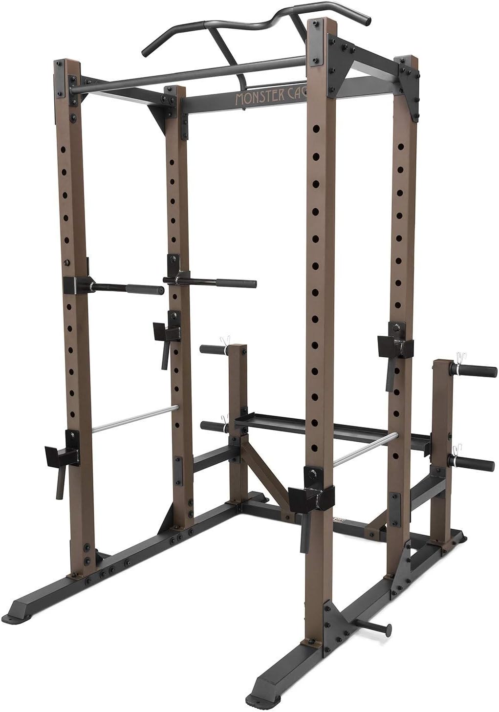 Detailed studio shot of the Steelbody Monster Cage from a low three-quarter angle showing the j-hook catches, plate storage horns, dip handles, and the MONSTER CAGE logo on the front crossmember